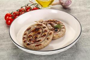 Grilled natural spiral meat sausage photo