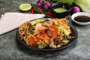 Asian cuisine - Fried noodles with seafood photo