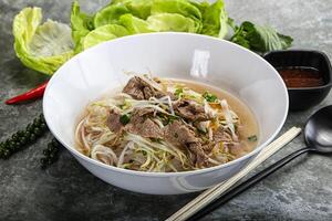 Vietnamese traditional soup Pho Bo with beef photo