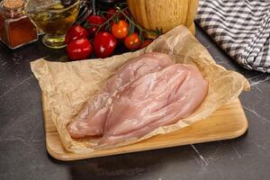 Raw chicken breast fillet for cooking photo