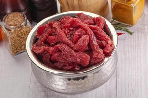 Raw beef meat - sliced strips photo