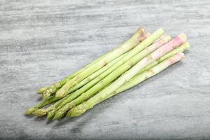 Raw green uncooked asparagus sprout photo