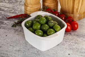 Green marinated Italian Selezione olives photo
