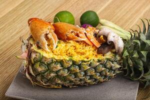 Rice with seafood in pineapple photo