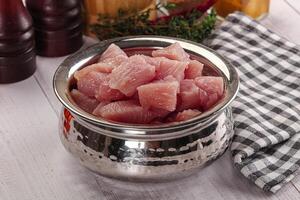 Diced raw turkey fillet cubes photo