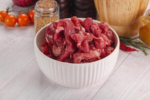 Raw beef meat - sliced strips photo