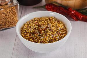 Spicy mustard sauce with seeds photo