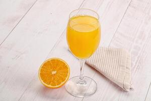 Sweet fresh orange juice in the glass photo