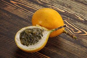 Yellow granadilla with cut half photo