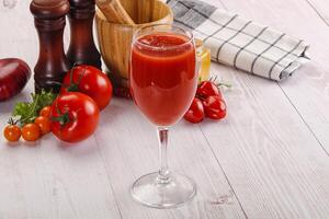 Fresh Tomato juice in the glass photo