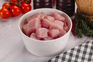 Diced raw turkey fillet cubes photo