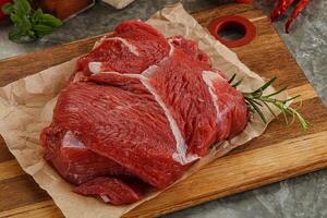 Raw beef meat piece for cooking photo