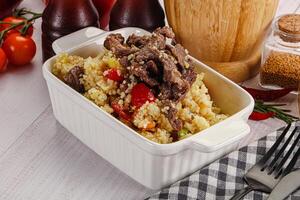 Traditional couscous with beef and vegetables photo