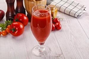 Fresh Tomato juice in the glass photo