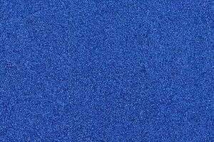 Vibrant Blue Football Turf Texture, Close Up Shot with Soft Focus Background photo