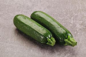 Raw green ripe zucchini vegetable photo