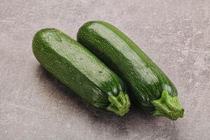 Raw green ripe zucchini vegetable photo