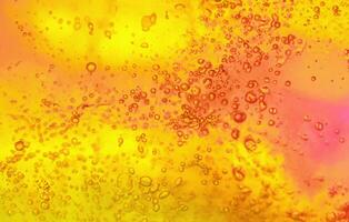 Bubbling Brilliance, Vibrant Gel Background with Abstract Texture in Yellow and Orange. photo