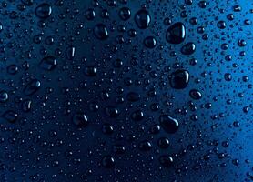 Water droplets on a background with a blue glass texture. photo