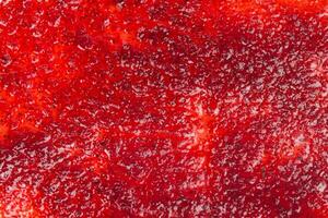 Top View of Vibrant Red Jam Spread, Perfect Background. photo