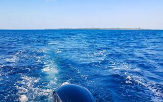 Motor engine of speedboat in the blue turquoise water Maldives. photo