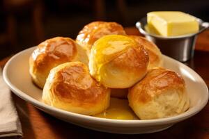 AI generated A plate of warm dinner rolls with melting butter. Generative AI photo