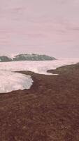 A majestic glacier surrounded by towering mountains video