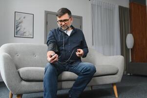 Senior man using medical device to measure blood pressure photo