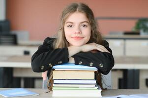 education and school concept - student girl studying and reading book at school. photo