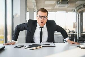 Angry businessman shouting at somebody photo