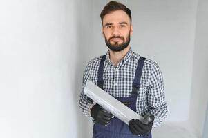 Positive male repairman at home photo