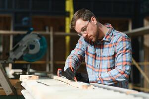 carpenter man furniture artisan handcrafted making woodwork at wood workshop photo