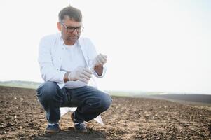 Testing Soil. Agronomist. Environmental protection, organic soil certification, Soil Fertility Analysis photo