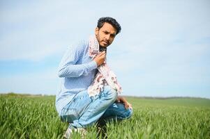 Indian farmer in his Wheat field photo