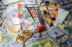 euro banknotes and coins, dollar banknotes with bitcoin. High quality photo. photo