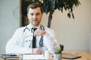 Portrait of a serious doctor in medical office. photo