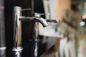 Water faucet, bathroom faucet and kitchen faucet. Chrome-plated metal. photo