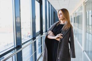 Modern business woman in the office with copy space photo