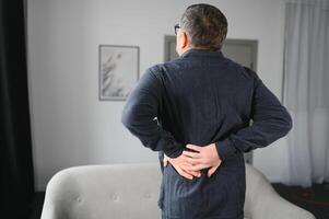 Older Senior Man With Back Pain Or Backpain photo