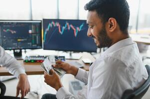 Two diverse crypto traders brokers stock exchange market investors discussing trading charts research reports growth using pc computer looking at screen analyzing invest strategy, financial risks. photo