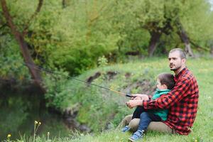 Father and son fishing together photo