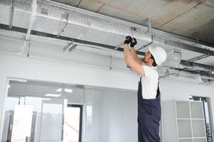 ventilation system installation and repair service. hvac technician at work. banner copy space photo