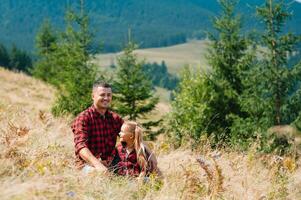 Happy father and little child are walking in the mountains. Father's Day. vacation in the national park photo