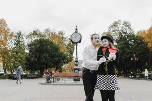 Mime on the street waiting to meet with his lover. Portrait of a mime comedian. mime on the street photo