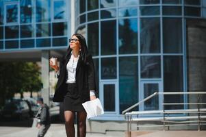 Young business woman portrait near office building photo