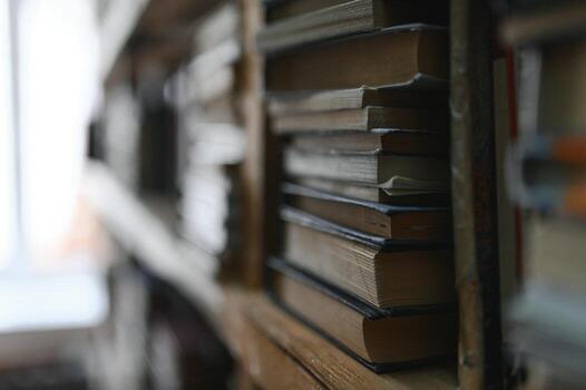 Blurred background of shelf with many multicolored books photo