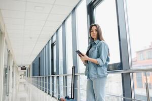 Girl at the airport window photo