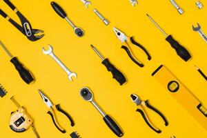 Set of various construction tools. Tools for home repair. Work at a construction site. On a yellow background. Flatly. Flatlay photo