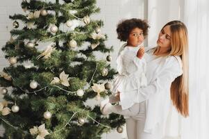 happy multiracial family with gifts at Christmas photo