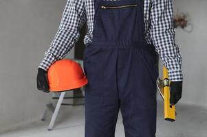 Young worker making repair in room photo